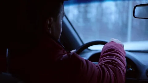 Shot back man drive the car geolocation transport hand holding winter automobile Stock Footage 105204893