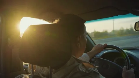 Shot back man drive the car face vehicle automobile hand male work journey Stock Footage 116998686