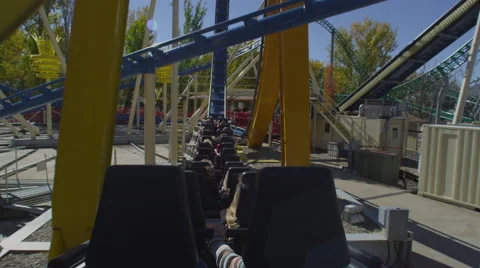 Shot from the back of a rollercoaster riding the twists of the track. Stock Footage 52263871