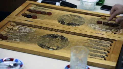 Shot of a backgammon play from above the board. Close up shot of two people play Stock Footage 75991821