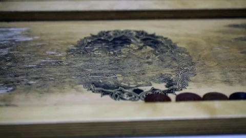 Shot of a backgammon play from above the board. Close up shot of two people play Stock Footage 75991947