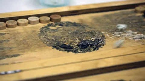 Shot of a backgammon play from above the board. Close up shot of two people play Stock Footage 75991972