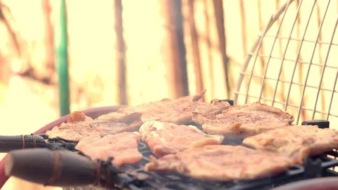 A shot of a barbecue meat being checking with fork Stock-Footage 89975980