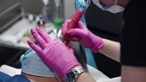 Shot of beauty salon, master using tattoo machine for microblading procedures Stock Footage 159603056