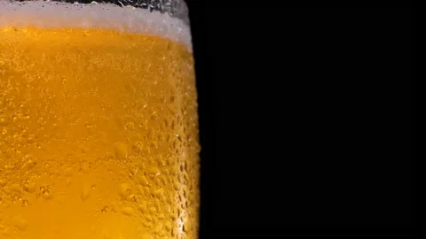 Shot of Beer Bubbles in Glass. Refreshing and cold beer in a beer glass Stock Footage 155686553