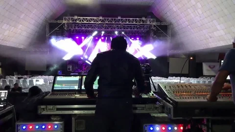 Shot from behind of engineer working at empty venue before a show Stock Footage 83254787