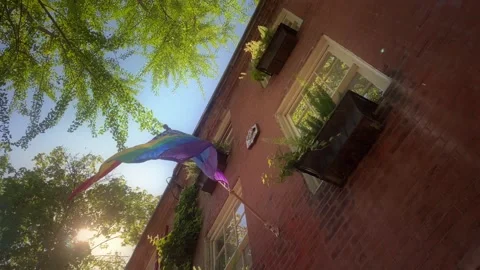 Shot from below windows of a lovely brick house in Philadelphia with a Stock Footage 140400180