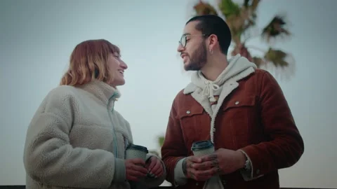 Shot from below of young Hispanic romantic couple enjoying conversation morning Stock Footage 136672997