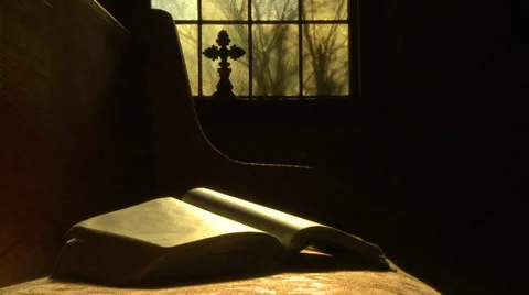 Shot of bibld on pew with window in background Stock Footage 33756779