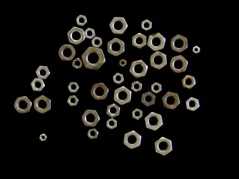 A shot of a bolt selection consisting of different sizes of bolts on black ba Stock Photos