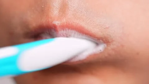 A shot of brushing the inner molars. Stock Footage 317076046