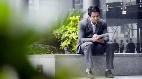 Shot of a businessman using a digital tablet Stock Footage 30077492