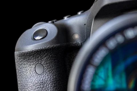 The shot button with lens of camera, close up. Photos