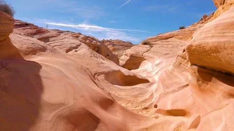 Shot Camera Movement On Dry Gorge With Smooth And Wavy Rocks Of Red Canyon 4K Stock Footage 86477290