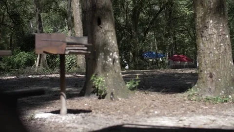 Shot of Campers and Tents with Grill in Foreground Stock Footage