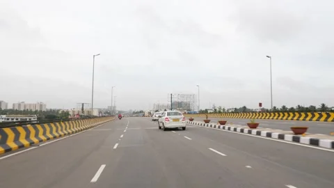 Shot of car passing over six lane bridge in India Video stock 156974477