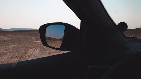 Shot from car, reflected in mirror. Desert mountain. Stock Footage 97570528
