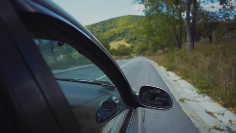 Shot car on road frame on window with mirror control safety transport auto Stock Footage 116997883