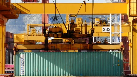 Shot of cargo green container moving up at Sinhangman Port Stock Footage 164010399