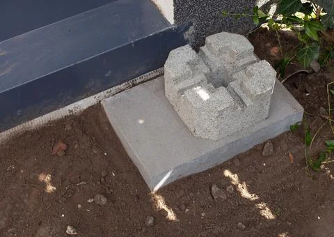 Shot of a cement deck block foundation installed on the ground Stock Photos