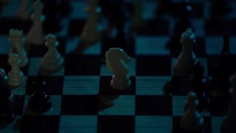 Shot of chess pieces with dramatic light moving and creating moving dramatic Stock Footage 155643945
