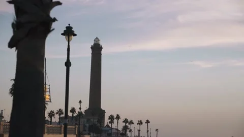 Shot of the Chipiona Lighthouse close to the sea at sunset in Cadiz Andalucia Stock Footage 232303633