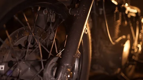 Shot close up of wheel, engine and exhaust of classic cafe racer motorcycle Stock Footage 111368253