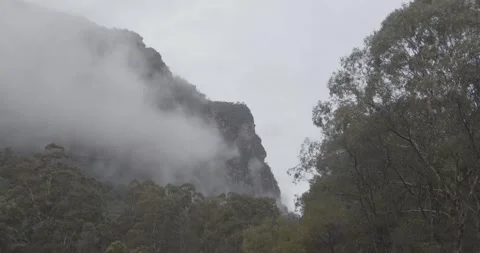 Shot of Clouds underneath the mountains at Coorongooba Campground Stock Footage 250071292
