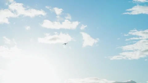 Shot of Cloudy Sky With Small Plane Flying By Stock Footage 300543837