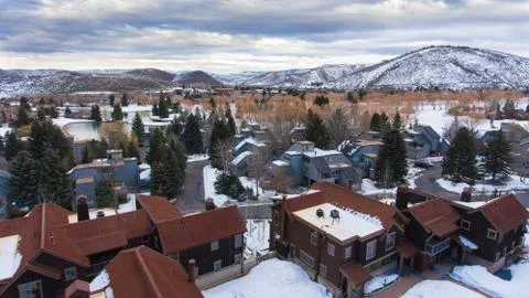 Shot Of Condos With Snow Mountain Backdrop Stock Photos