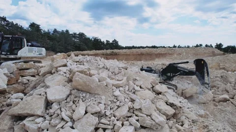 Shot of crawler excavator working on a quarry. Mining industry concept. Stone Stock-Footage 209280425
