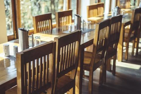Shot of a dining table with focus on the dining chairs captured in interior o Stock Photos
