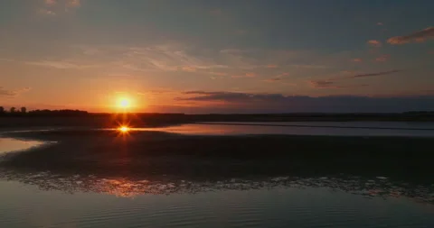 Shot of a Drying Lake During a Beautiful Sunset Stock Footage 274915397