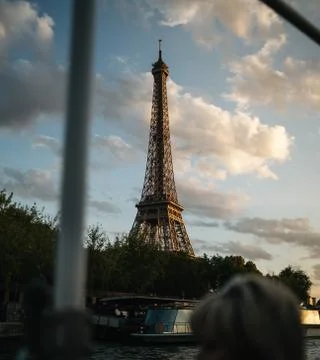 Shot of Eiffel Tower at sunset from boat sailing on Seine river, Paris Stock Photos