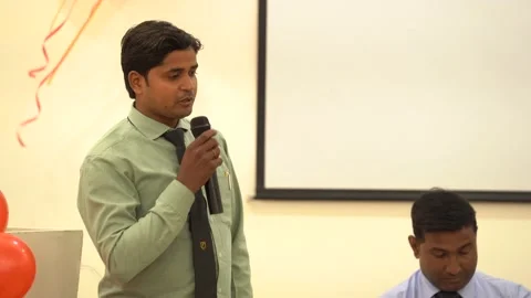 Shot an Employee giving a thank you speech at the Office Awards function Stock Footage 166345243