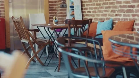Shot of empty cafe restaurant interior with table settings chair elegant dolly Stock Footage 138656883