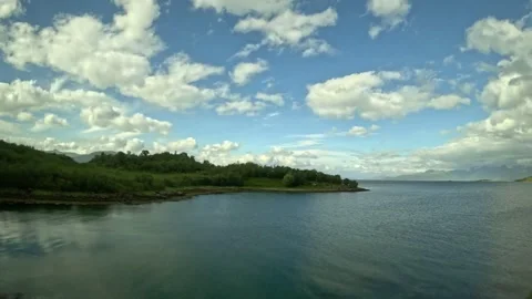 Shot of expansive sea bay under vibrant blue cloudy sky in Norway Stock-Footage 343833902