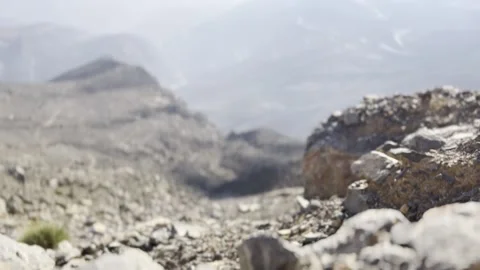 Shot of falling rock in scenic view of mountain valley Video stock 227137168
