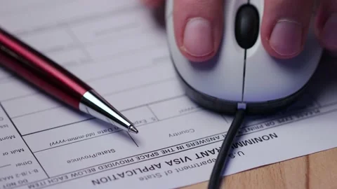A shot of filling out visa documents Video stock 232469259