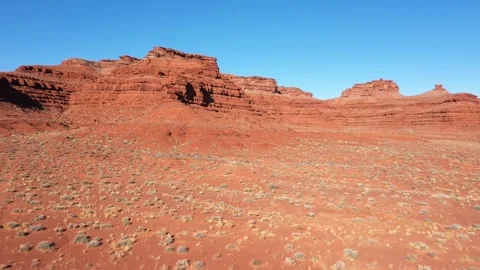 Shot From Flying Drone Over Desert To Red Rocky Remnants Of Canyon Video stock 274479929