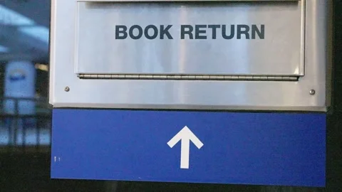 Shot of the front of a generic library book return box Stock Footage 146504841
