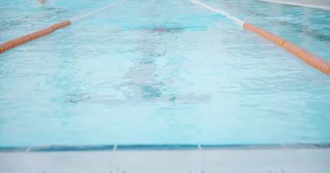 Shot from front side of professional swimmer performing breaststroke during 스톡 동영상 120300849