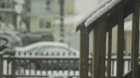 A shot of the front yard and steps as the snow piles up on the balustrade Stock Footage 59111508