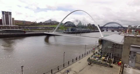 Shot of Gateshead Millenium Bridge starting with closeup Swirle Pavilion Stock Footage 159133924