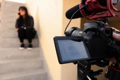 Shot of a girl from behind the scene of a short film Stock Photos
