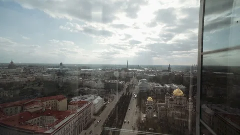 Shot from going down with elevator in city centre next to main and busy Stock Footage 126200492