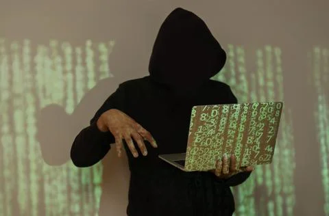 Shot of hacker using laptop. Lots of digits on the computer screen. Stock-Fotos