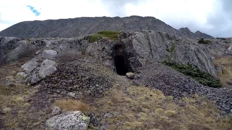 Shot of hiking to a mountain cave Video stock 79577034