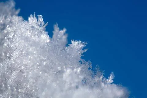 Shot of ice crystals. Winter pattern with white snowflakes on the background of Stock Photos