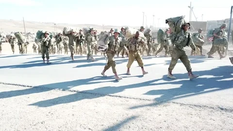 Shot of IDF Soldier Troops walking hand in hand during war games Stock Footage 229680694